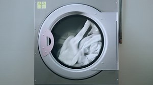 clip-25972244-industrial-washing-machine-clothes-laundry-working-clothing
