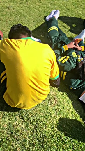 Casual Outdoor Hangout: Young Males in Sports Uniforms