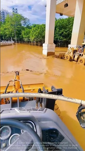 The process of a bulldozer clearing silt