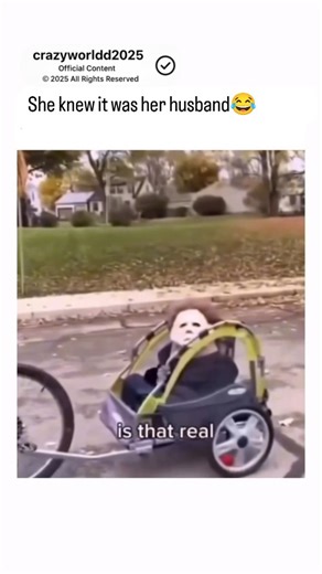 crazyworld on Instagram: "This viral video captures a hilarious domestic moment where a woman pulls into her driveway to find her husband casually riding a pink bicycle while dressed as Michael Myers from the Halloween franchise. Adding to the absurdity, he is towing a child carrier containing their son, who is also wearing a matching Michael Myers mask. The woman’s exasperated tone—asking if she can ever come home to a "normal" house—highlights the couple’s playful dynamic. The contrast between