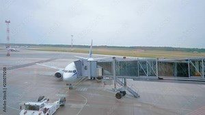 Detaching of the air bridge from the airplane before flying.