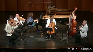 Camille Saint-Saëns's Septet in E-flat major features an unusual instrumentation, including a double bass and a trumpet. The piece was written as a Christmas present for the composer’s friend, Émile Lemoine, a wealthy mathematician and musician who had long pestered Saint-Saëns to write something for trumpet. The septet’s lively neo-Baroque style was a hit, praised for its blend of charm, clarity, and wit. This 2024 Music@Menlo performance features violinists Benjamin Beilman and Lun Li, violist