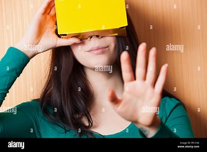 Plain cardboard augmented reality headset lets you get into playing video games on your smartphone in a innovative style Stock Photo - Alamy
