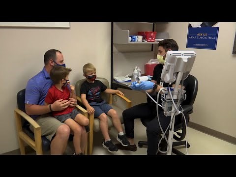 Kids 5 and up get shots in vaccine trial