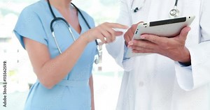 Video of doctor and nurse using tablet computer