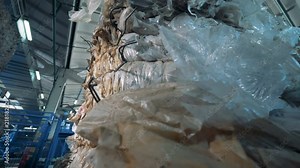 A pile of polyethylene rubbishpacked into piles ready for recycle.