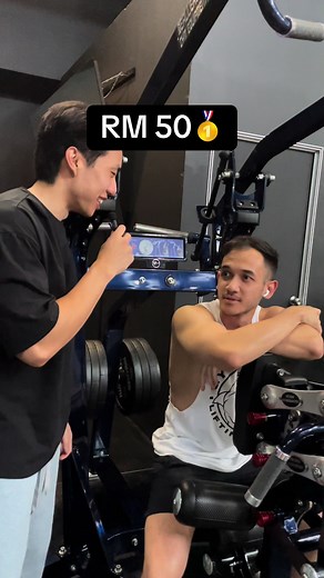 Challenging Gym Goers to Win RM50 with Weighted Pull-ups
