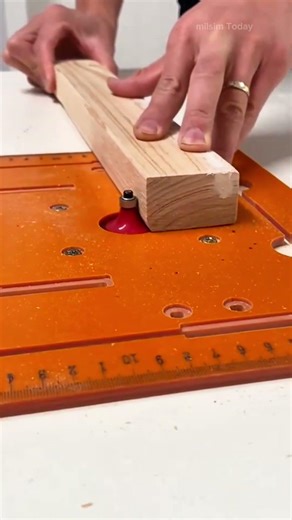 Shaping edges of wooden boards using a router table to achieve smooth and decorative side profile