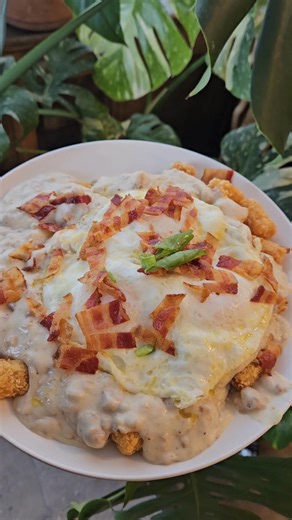 Tiny tots breakfast special 😋 Tater tots topped with American cheese homemade sausage gravy eggs bacon & green onions - a delicious breakfast to kickstart your morning! | Wild Rose Family Restaurant