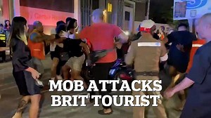 Angry mob attacks a Brit tourist after crash leaves woman in a coma