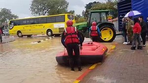 Kids rescued by boat from flooded school in south
