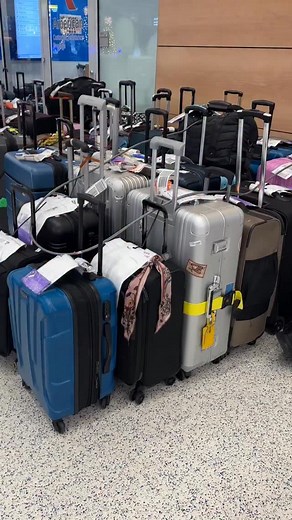 Tuesday morning unclaimed luggage waiting at Newark Airport, terminal A, for American and Delta. Today the FAA mandate goes to a 6 percent reduction in operations. | Lauren Due