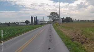 Driving Along Amish Countryside Came Across an Amish Farmer Working and Amish Farm