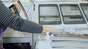 Typography - polygraph printing process - a woman's hand completes a paper for a magazine