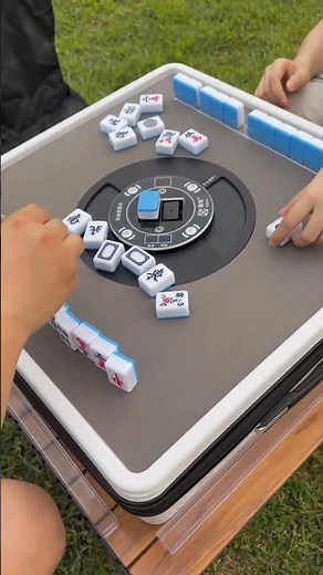 automatic Mahjong table, a modern device that shuffles and stacks tiles automatically for gameplay