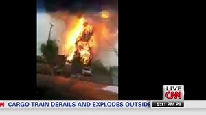 Explosion surprises man filming fire