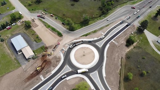 Trucks drive through the roundabout on M-37 in Blair Township Monday afternoon. (Record-Eagle video/Andrew Rosenthal) | Traverse City Record-Eagle