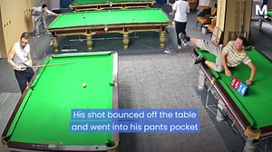 Cue ball lands in a player's pocket in a hilarious billiards error.