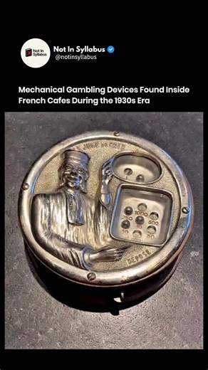 Not in Syllabus on Instagram: "This compact French slot device dates to the 1930s, when gambling machines quietly entered everyday social spaces. Cafes and pubs placed machines like this on counters or near entrances to attract casual play. The mechanism worked through gears, springs, and levers, with no electricity involved. Each pull triggered a fixed mechanical sequence, so outcomes depended entirely on physical alignment, not software. Governments later tightened gambling laws, leading to ma