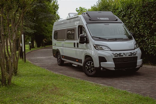 This Clever Camper Van Has a Massive Toy Garage and Flawless Drop-Down Bed Interior