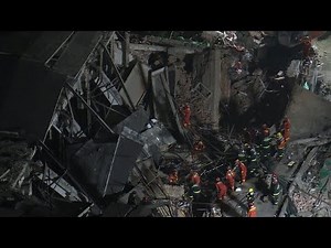 Diggers search rubble on site of Shanghai building collapse