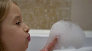 Child Enjoying Playful Bath With Foam Stock Footage SBV-319520723 - Storyblocks