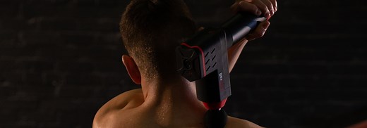 How to use a massage gun on your shoulders