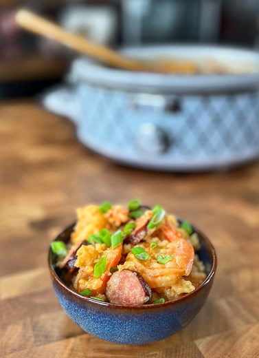 I learned this at the border of Texas and Louisiana! CJ is showing you how to make this amazing crock pot cajun rice dish. With Cajun seasonings, shrimp, Texas sauage and Rotel, combine to make this awesome one pot fusion dish! What would you throw into this crock pot? #crockpotrecipes #cajunfood #crockpotmeals | Cooking with CJ