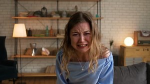 portrait of beautiful blonde angry woman being very unhappy hysterize and shout with tears looking at the camera because of big trouble and stress