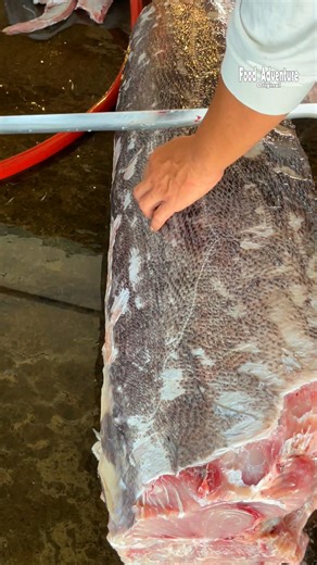 987K views · 5K reactions | What is he cutting? looks like snake skin  #snakeSkin #viral #satisfying | Food Adventure | Facebook