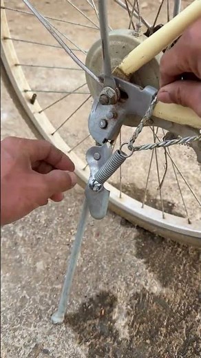 The process of installing a bicycle kickstand tension spring with a rope