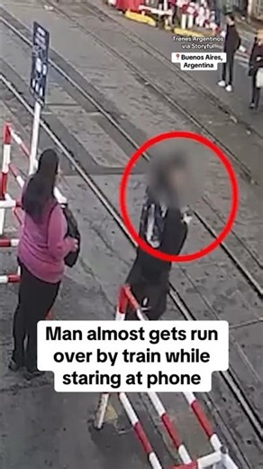 Man almost gets run over by train while staring at phone #shorts