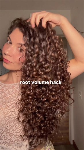 Root volume hack! I clip the top section of my hair with a clip after styling that has long teeth and leave in for at least 15 mins, I take the clip out and diffuse dry as normal. #curlyhairhacks #curlyhairtips #rootvolume