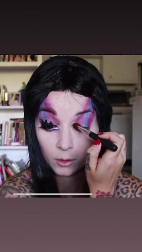 6.2K views · 95 reactions | Another throwback Halloween makeup tutorial. I can’t believe this Elvira look was 9 years ago!! Anyway… here’s another Halloween costume idea. Her bangs are longer and spikier but I actually trimmed my wig so you could see the makeup better. .Eyeshadows and lashes are all @sugarpill Liner is schwing! By @thebalm Lipstick is Ruby woo by @maccosmetics #elvira #elviramakeup #halloweenmakeup #halloweencostumeideas | Cherry Dollface | Facebook