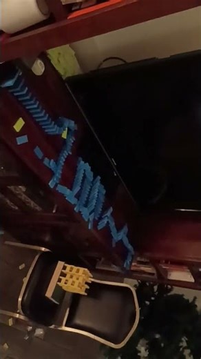 Super Cool Domino Setup On Bookshelf And TV Stand