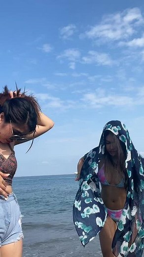 Playful Beach Moments: Stylish Swimsuits and Fun