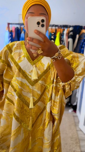 LUXURY BROCADE BOUBOU DETAILS. High-quality metallic brocade fabric with a rich gold design • Elegant V-neckline with gold embroidery and tassel accents • Loose, flowing fit – flattering for all body types • Short wide sleeves for comfort and mobility • Luxurious and breathable texture perfect for any season • Ideal for: parties, weddings, religious events, or cultural occasions FABRICS : BROCADE COLOUR : GOLD SIZE (UK): ONE SIZE LENGTH : 60 PRICE : £50 Available in the UK DM or WhatsApp : 44735
