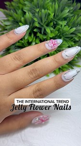 These Jelly Flower Nails are sure to make heads turn and make your hands look sensational🌸✨Follow the below steps! . . Step 1: Apply five delicate dots of jelly nail polish, strategically placed for a floral effect. Step 2: Use a fine brush to gently flatten each dot from the base, forming intricate petal-like patterns. Step 3: Define the design with a shimmering outline using silver nail paint, adding a touch of elegance. Step 4: Infuse a soft pink gel paint at the heart of each flower, extend