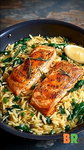 Easy One-Skillet Salmon & Lemon Orzo Pan-seared salmon is paired with tender orzo simmered directly in aromatic broth, creating a cohesive skillet dish with layered flavor and efficient technique. Bright lemon notes and wilted spinach finish the pasta base, while gentle heat keeps the salmon moist and delicately flaky. 🛒Ingredients : 4 skinless salmon fillets 1 teaspoon salt, divided 1 teaspoon coarsely ground black pepper, divided 1 teaspoon sweet paprika 1 teaspoon garlic powder 1 tablespoon 