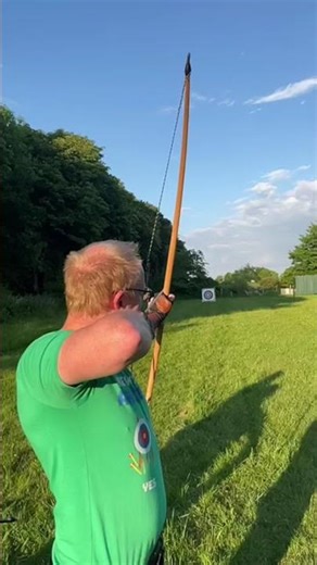 Slowmotion of longbow shooting wooden arrow