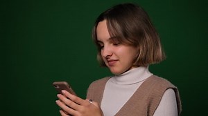 Woman messaging on mobile phone