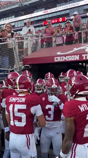 Ty Simpson leading the team out to warmups | Cover Crimson