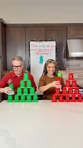 Balance it, Stack it, Win! Getti and Mike play a holiday cup stacking game while balancing a Christmas ornament #christmasgames #familygames #christmas2024 #cupstacking #HolidayPartyIdeas #holidaygames #Holidayseason2024 | The Tus House