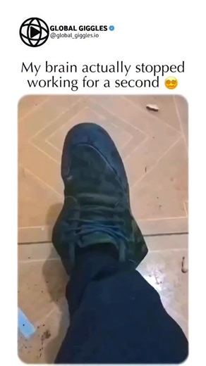 Global Giggles on Instagram: "The post shares a short video clip of a mind-bending optical illusion where a person's foot initially appears as a shapeless, melted green blob on the floor, only for the camera angle to shift and reveal a girl wearing flexible footwear, blending visual confusion with a satisfying reveal for viral appeal. Posted around October 2025, the footage demonstrates a perfect "anamorphic" trick—using specific camera angles to distort reality before correcting it—likely achie