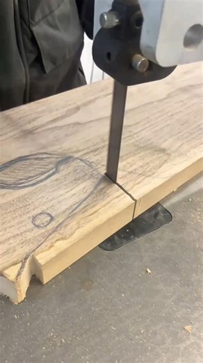 cutting a circular shape from a wooden board using a sharp vertical band saw #shorts