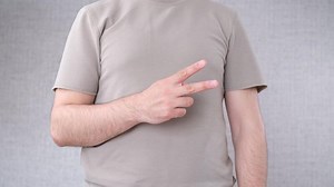 man showing two finger sign. High quality 4k footage