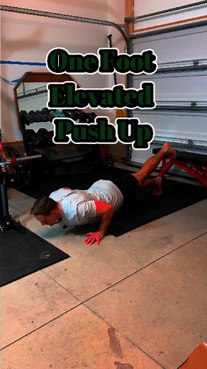 One-Foot Elevated Push-Up: Why It’s More Than Just a Fancy Variation This isn’t just a “spicier” push-up — there’s a purpose behind it. By lifting one foot off the ground, you’re adding instability. And anytime you add instability, your core has to kick into overdrive to keep your body from twisting, collapsing, or overcompensating. That means more core engagement and more total body control — without changing the primary goal of the push-up: upper body pressing strength. It’s also a great way t
