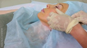 Aged woman doing mesothreads and Thread Lifting, Cosmetology. Cosmetic procedure to eliminate signs of aging. Beauty Face, Facial contour, plastic surgery concept for Age 40-50 years.