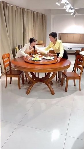 round dining table set featuring a lazy susan turntable, typically designed for communal dining.d