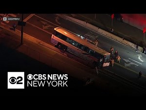 NJ Transit bus gets stuck on road divider in Jersey City